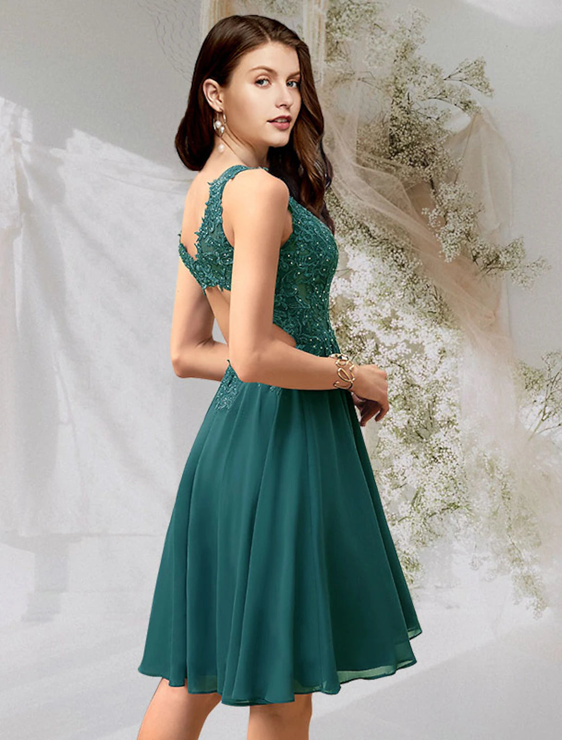Back view of a woman wearing a Weitese A-line V-neck short cocktail dress, highlighting the backless design.