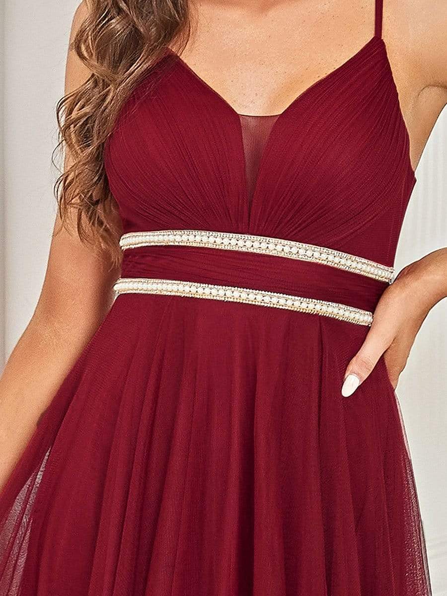Weitese red V-neck high-low pleated tulle prom dress, back view.