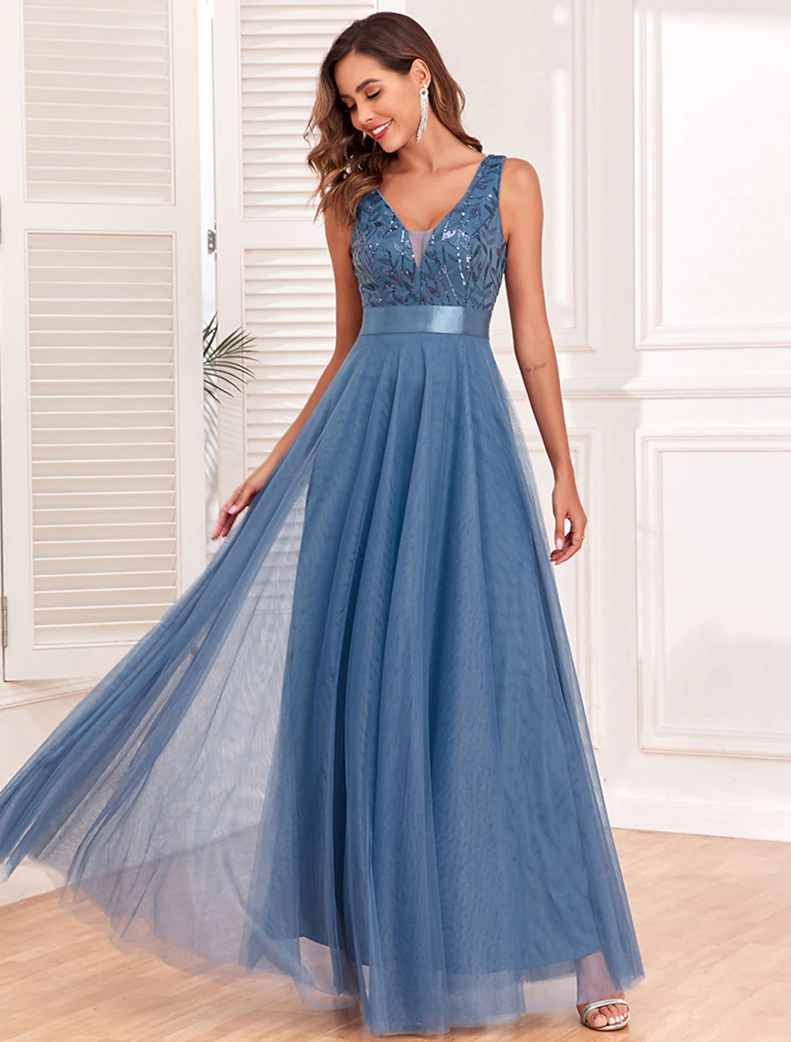 Back view of the A-line evening gown featuring a V-back design.