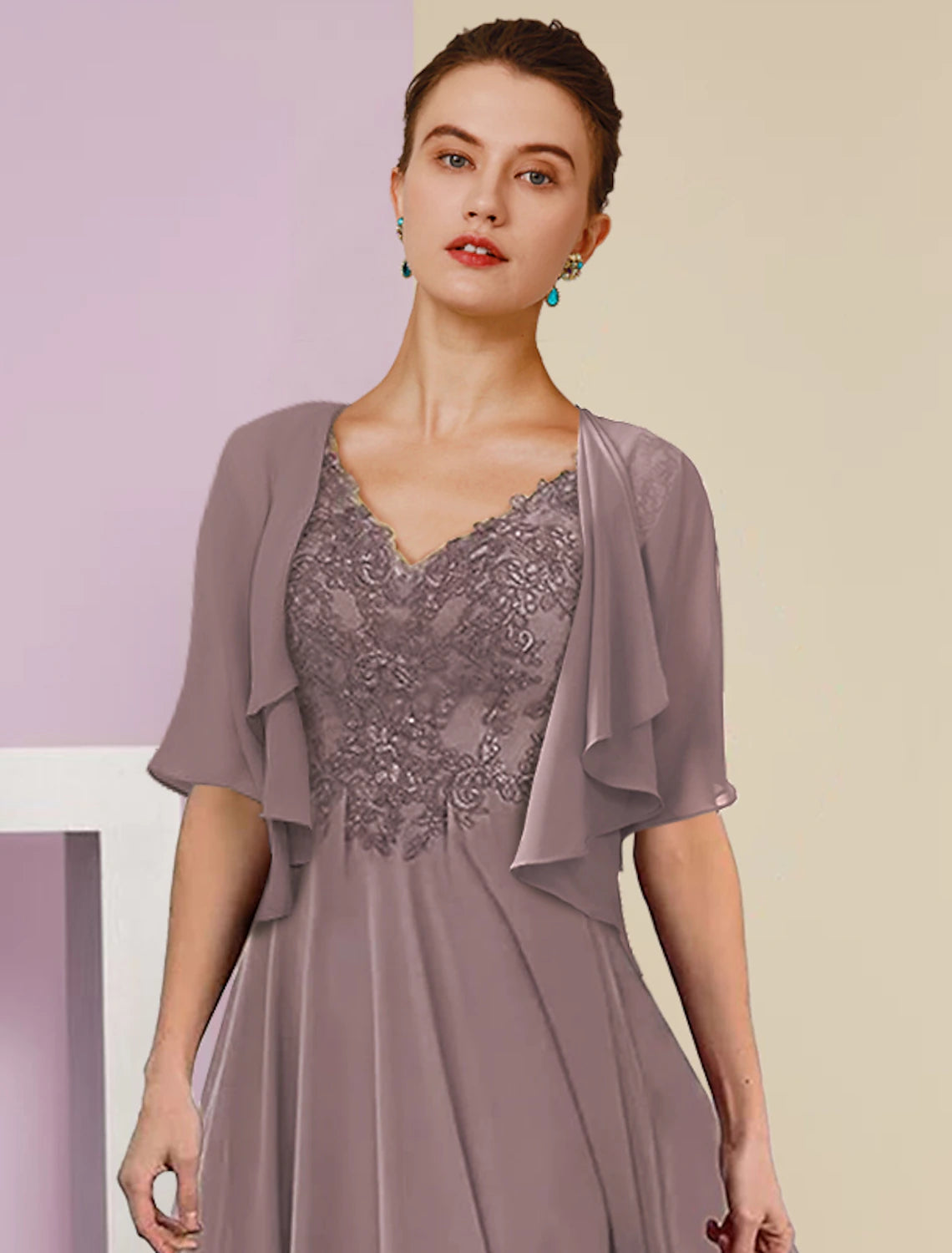 Close-up of the intricate lace and applique details on the chiffon dress.