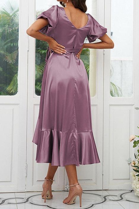 Back view of an A-line V-neck short sleeve bridesmaid dress with ruffled details.