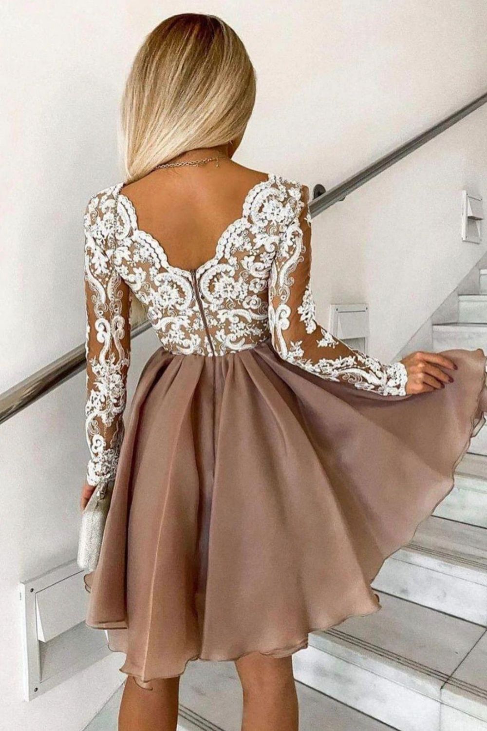 Back view of the modest A-line homecoming dress with long sleeves.