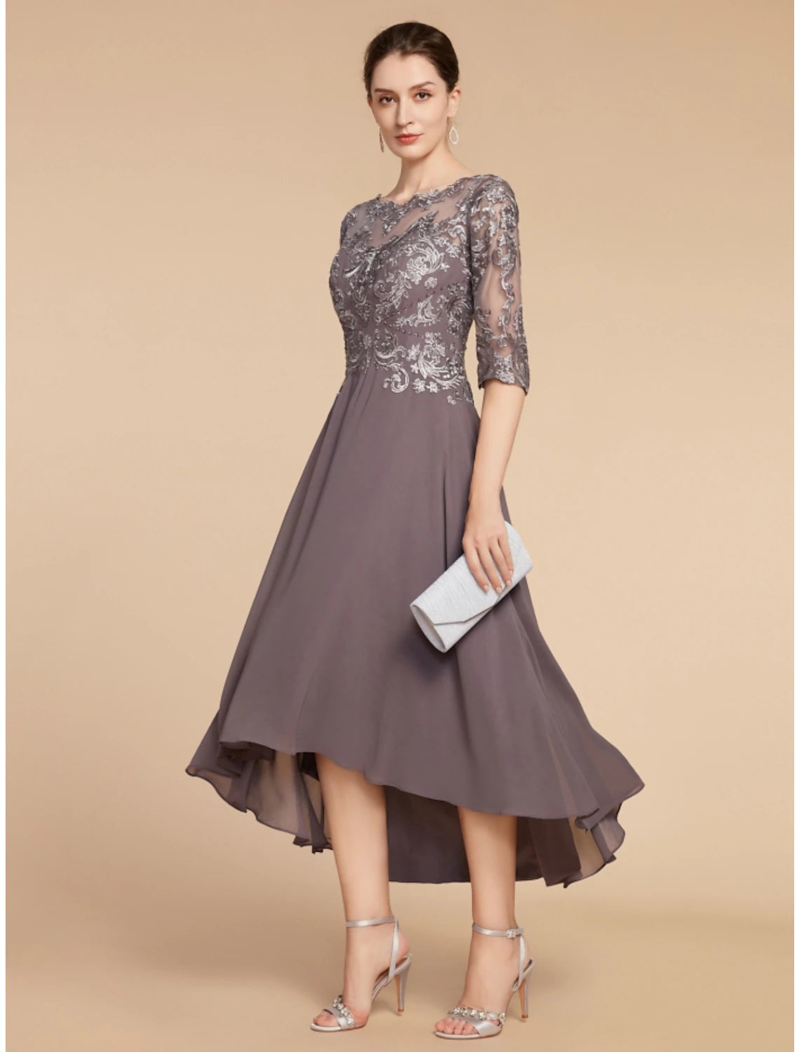 Woman in elegant A-line scoop neck half sleeve ruched chiffon lace dress with asymmetrical hem.