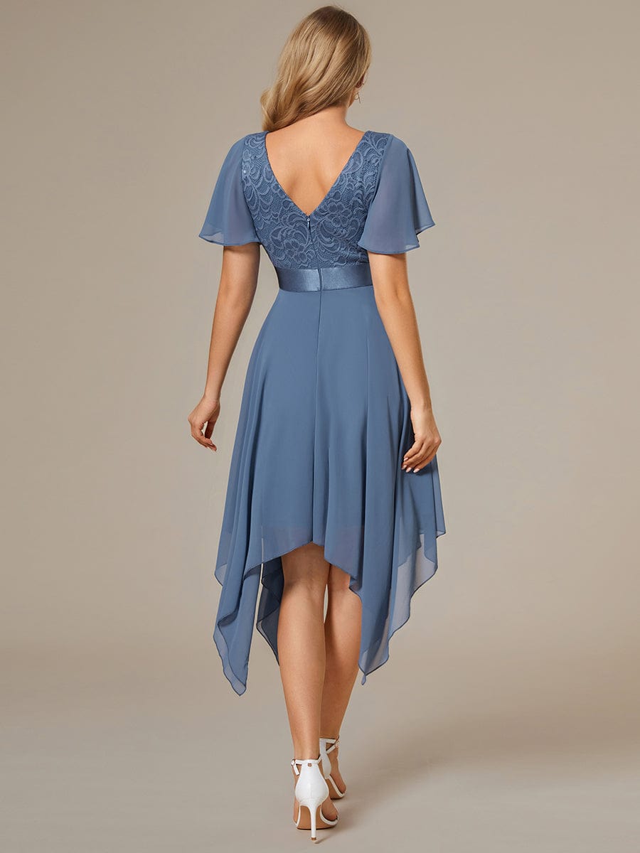 Side view of model in a navy Weitese knee-length bridesmaid dress.