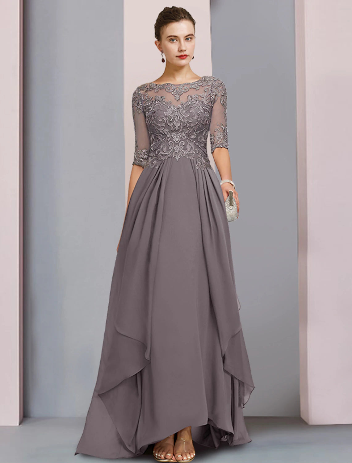 Woman wearing an elegant Weitese sheath column dress with a scoop neck and half sleeves.