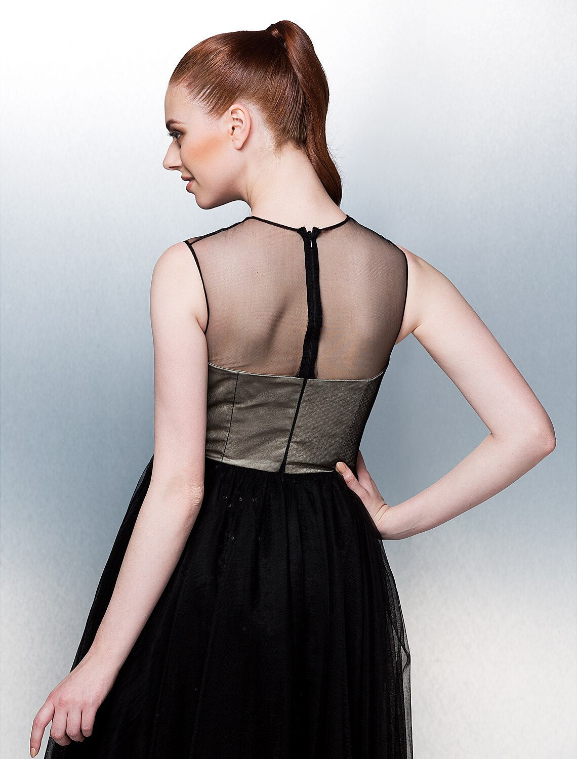 Detail of the tulle skirt and delicate appliques on the tea length dress.