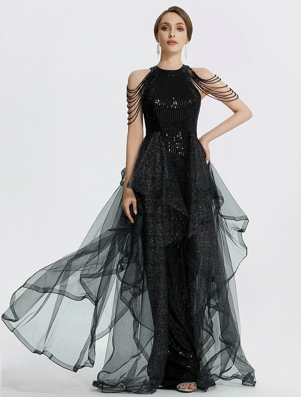 Full view of a black mermaid trumpet dress with jewel neck, short sleeves, and beading.
