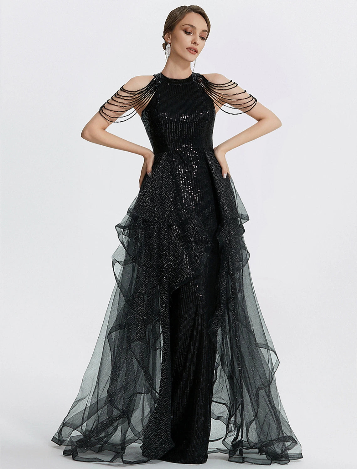 Back view of the black formal dress, showing the short sleeves and floor-length design.