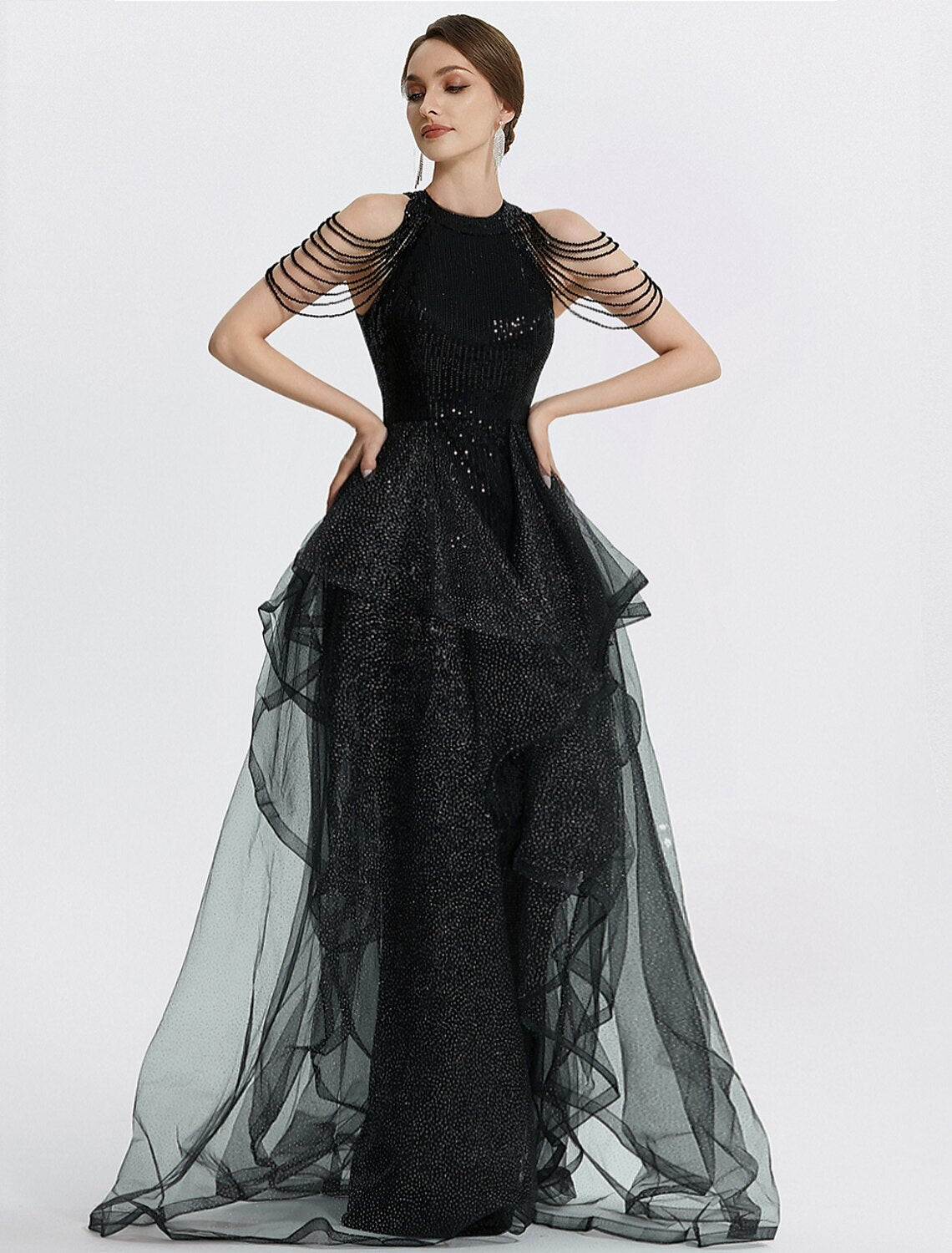 Close-up of the jewel neck and intricate beading on the black tulle dress.
