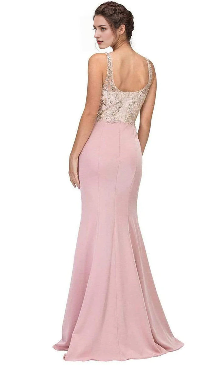 Side view of a woman in a dark blue beaded illusion scoop mermaid prom dress, showcasing the flowing train.