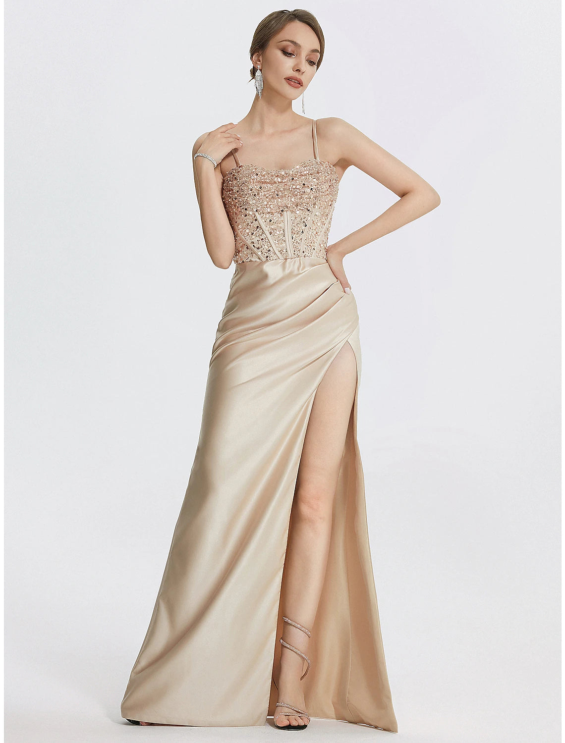 Close-up of the delicate feather trim and stretch fabric on the black evening gown.
