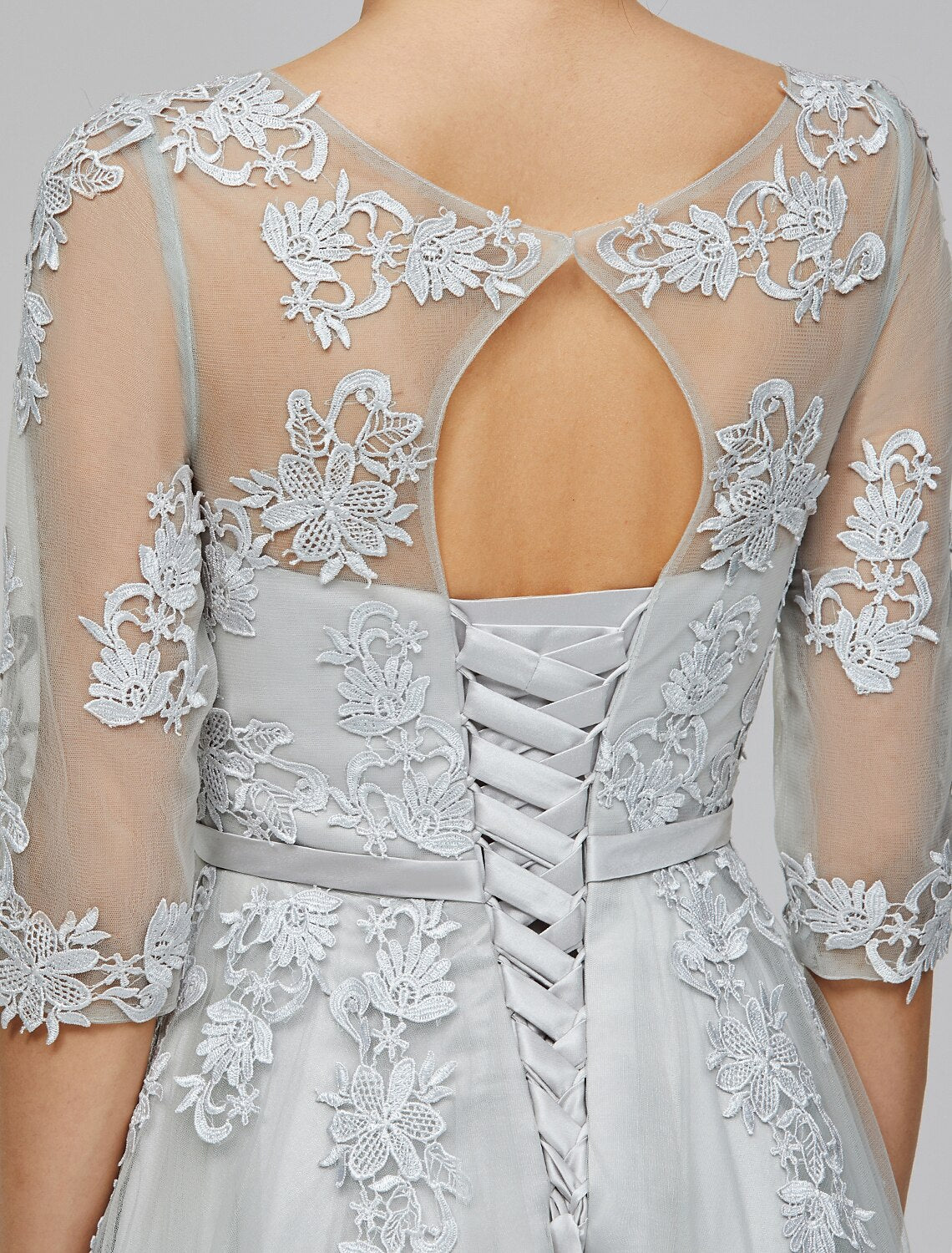 Blush A-line empire gown with a graceful silhouette, perfect for formal events.