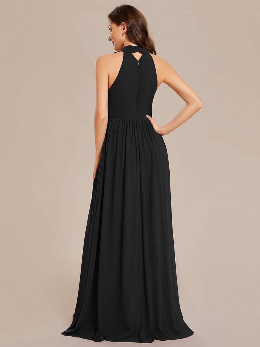 Black Weitese chiffon halter dress, side view, highlighting the high slit.