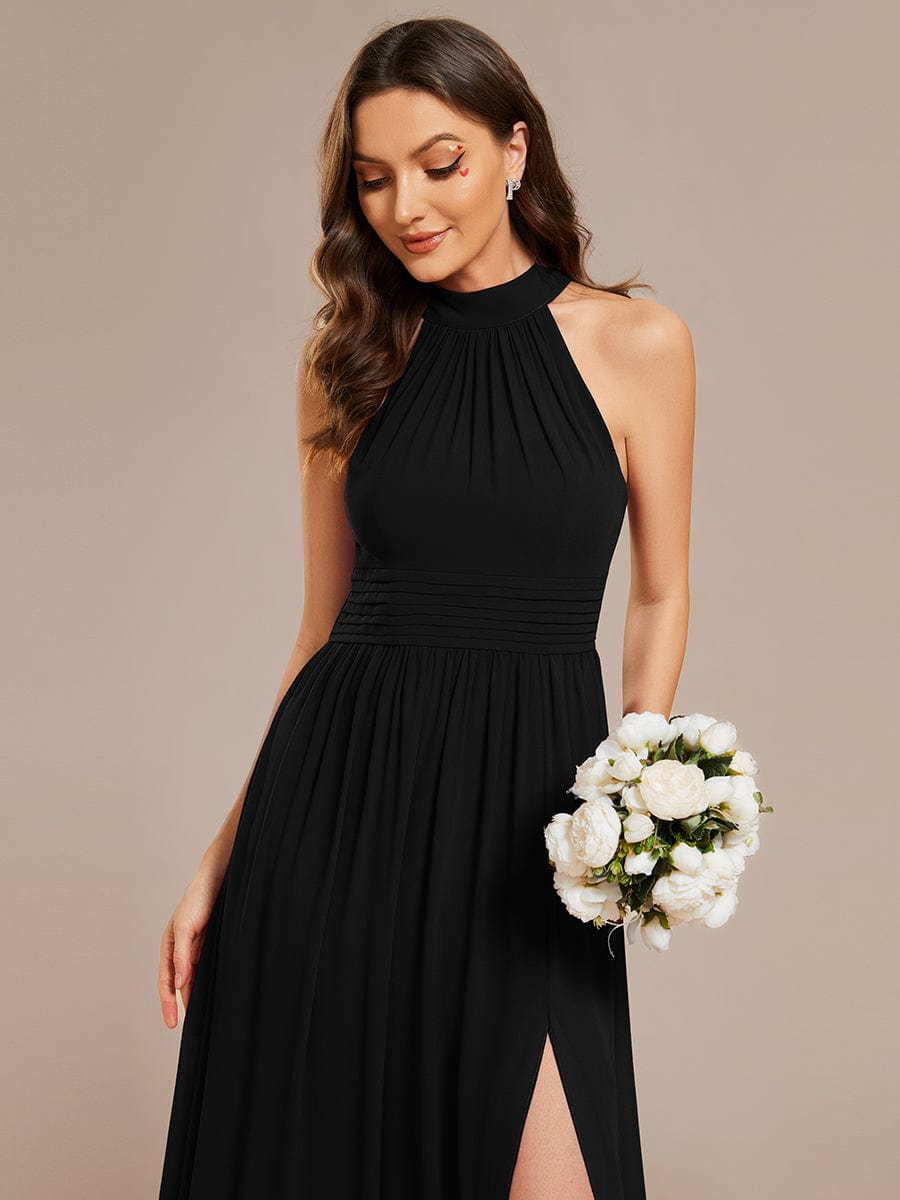 Close-up of the pleated bodice on a black Weitese chiffon dress.