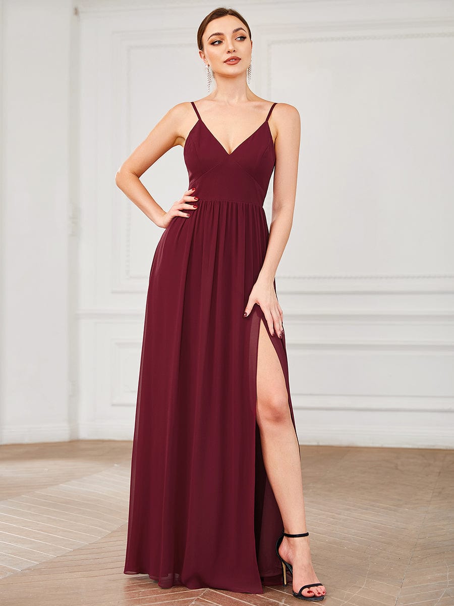 Model in a red Weitese chiffon bridesmaid dress with plunging V-neck and front slit.