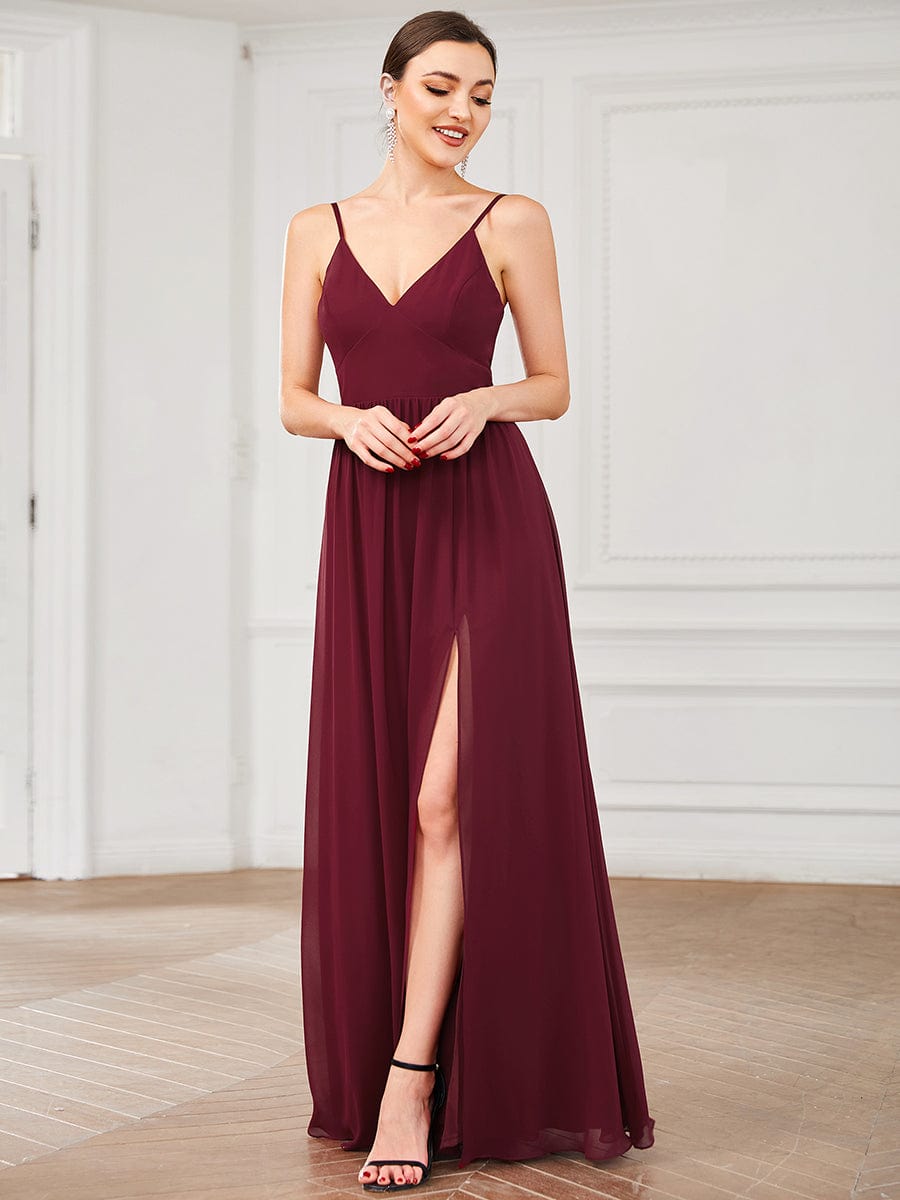 Side profile of the red chiffon dress, showcasing its flowing fabric and elegant drape.