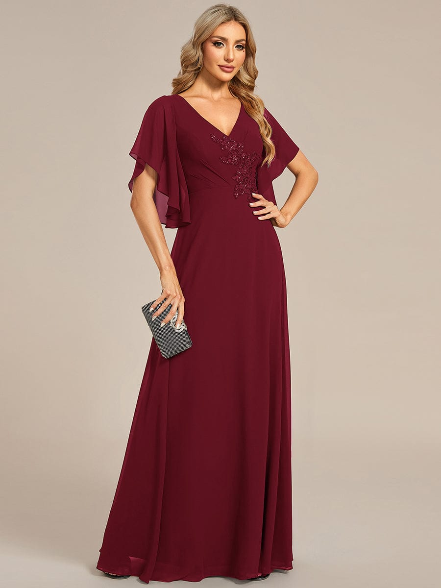 Elegant blue chiffon Mother of the Bride dress with half sleeves and delicate applique.