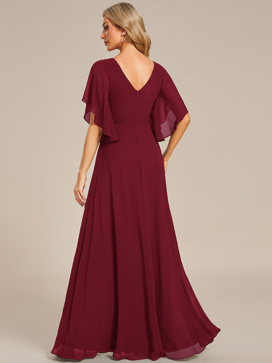 Side view of the blue chiffon Mother of the Bride dress, showcasing its flowing silhouette.