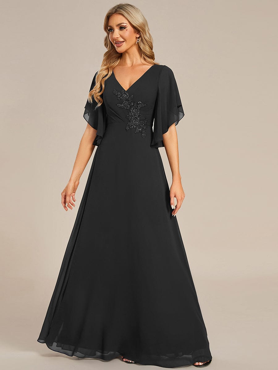Black chiffon Mother of the Bride dress featuring elegant half sleeves and applique details.