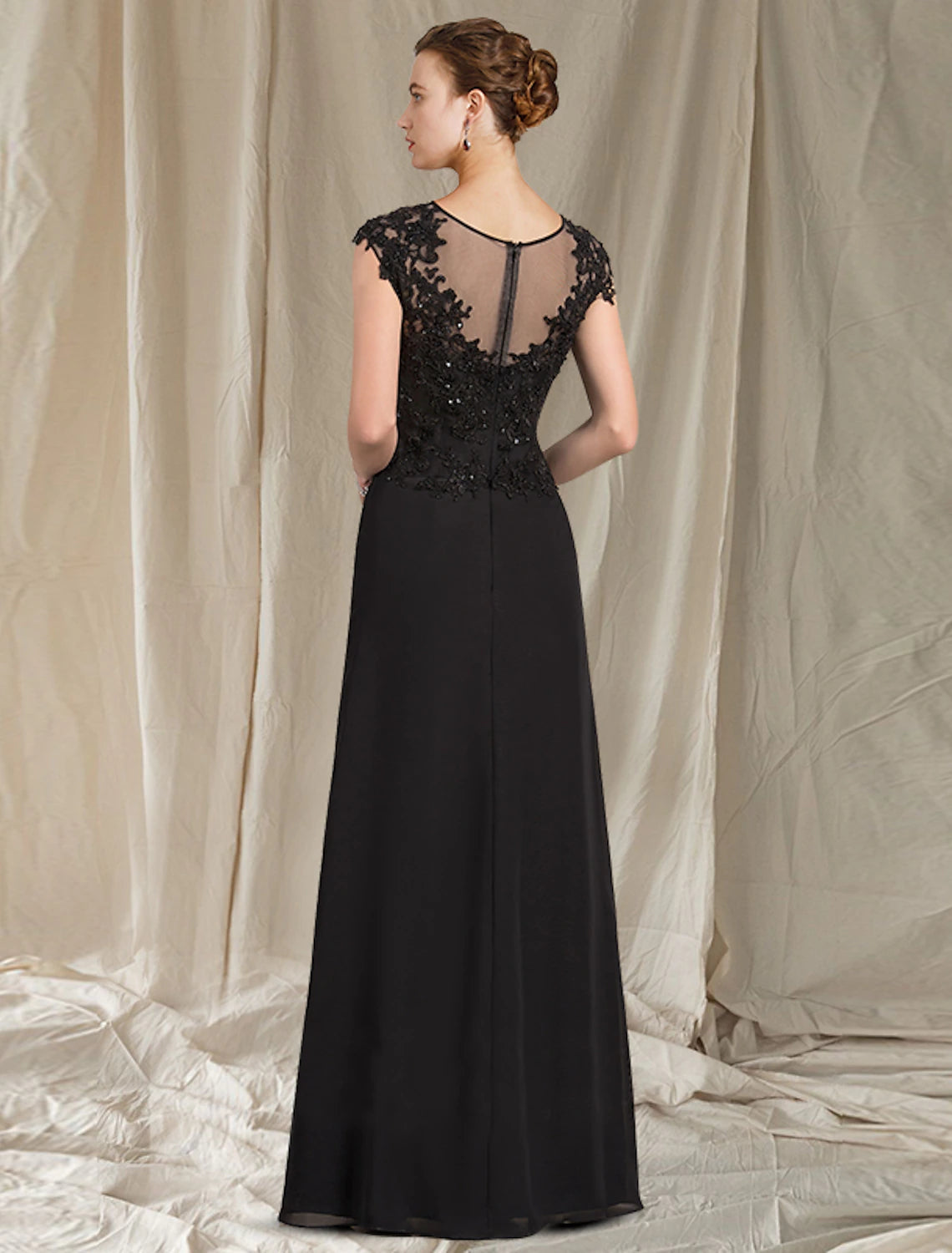 Weitese Mother of the Bride dress showing jewel neck and short sleeve details.