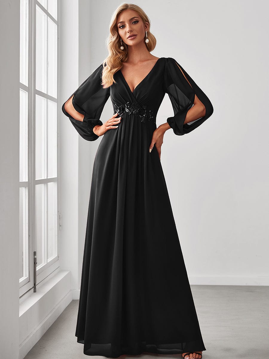 Model wearing a black Weitese chiffon V-neck long sleeve formal evening gown.