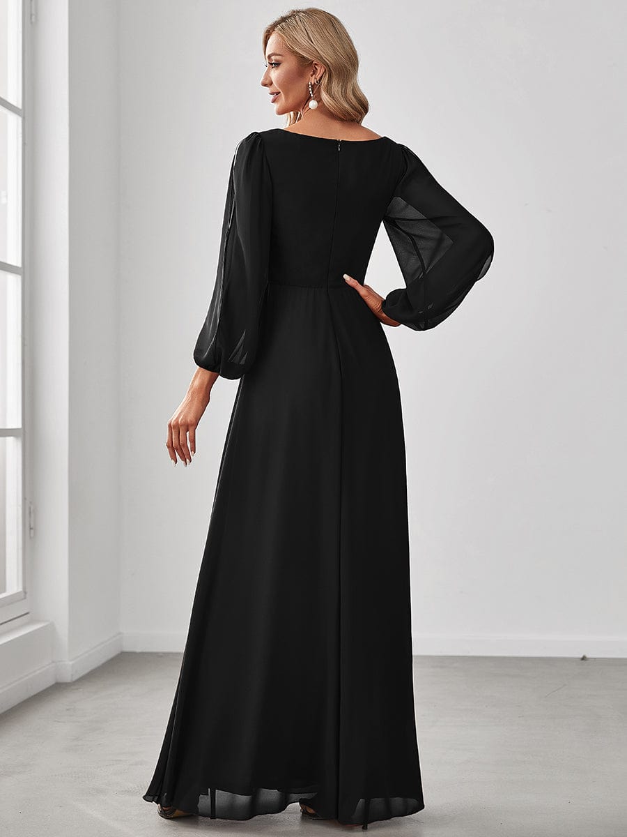 Back view of a model in a black Weitese chiffon formal evening dress.