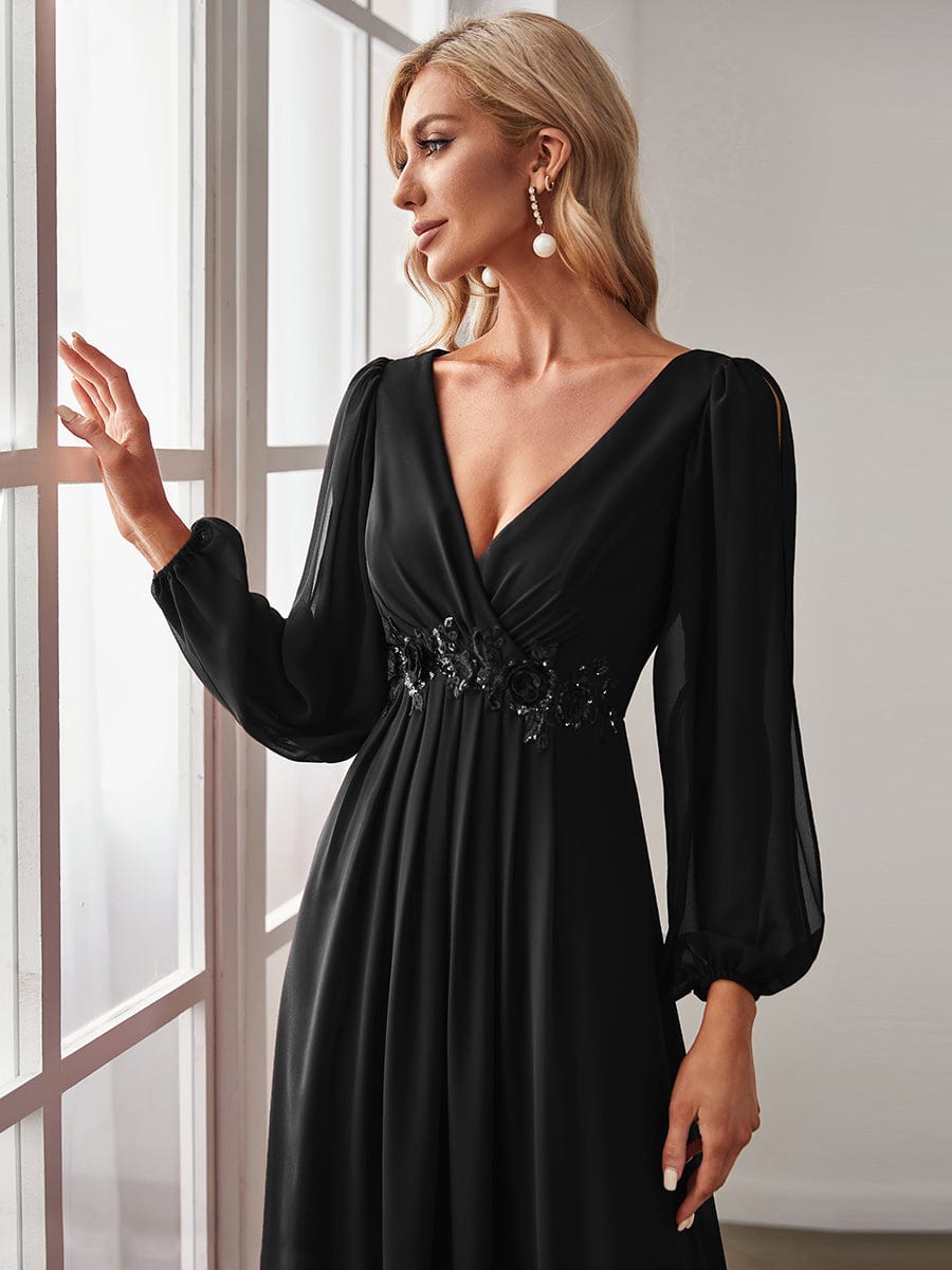 Side profile of a model showcasing the black Weitese long sleeve evening gown.