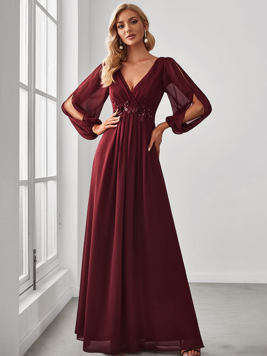 Model wearing a burgundy Weitese chiffon V-neck long sleeve formal evening gown.