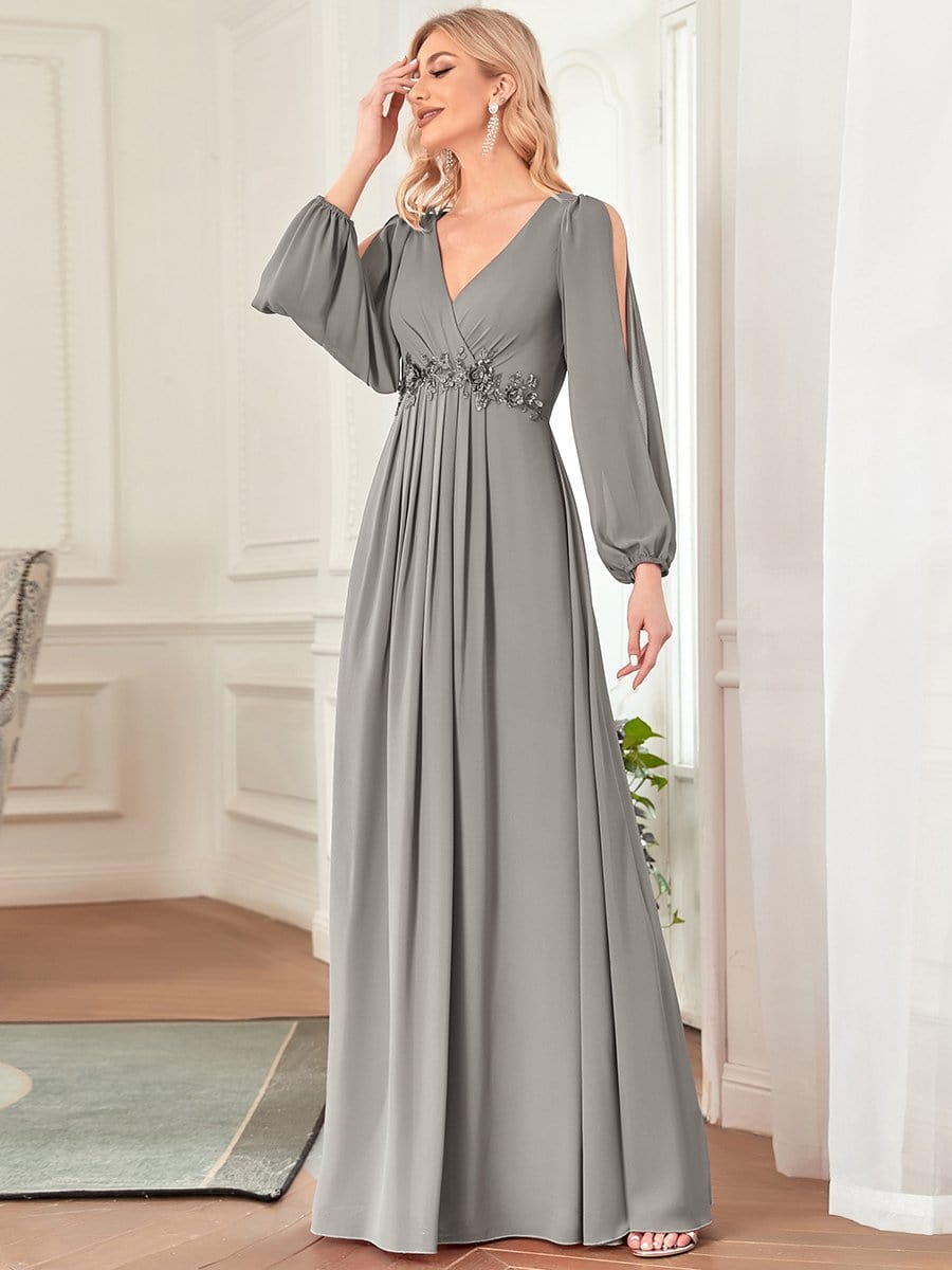 Model wearing a grey Weitese chiffon V-neck long sleeve formal evening gown.