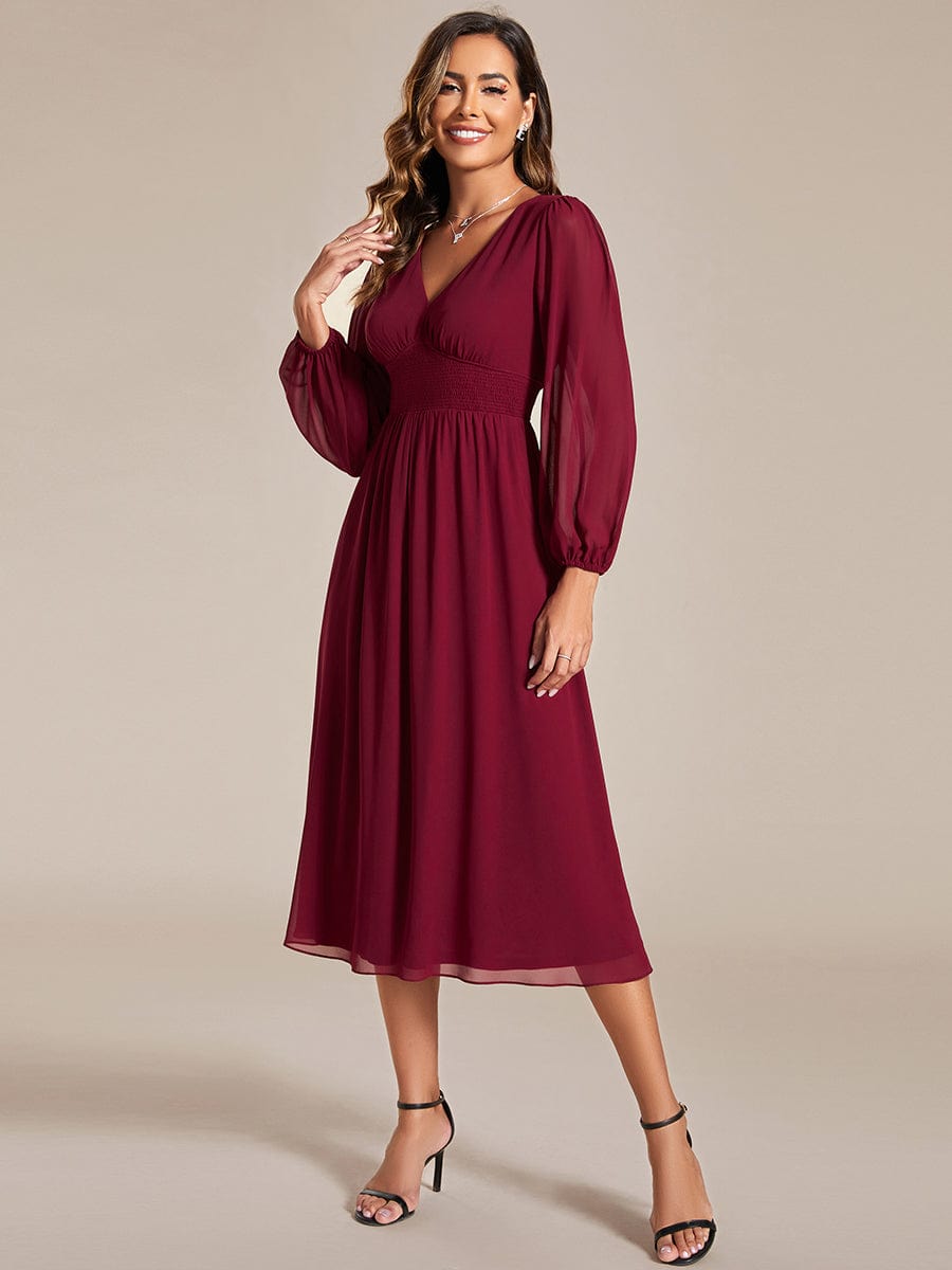 Model wearing Weitese burgundy chiffon V-neck long sleeve midi dress.