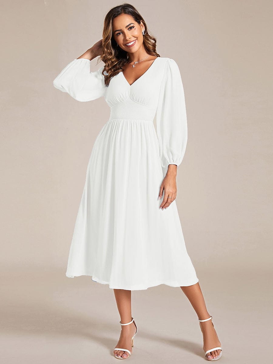 Model wearing Weitese white chiffon V-neck long sleeve midi dress.