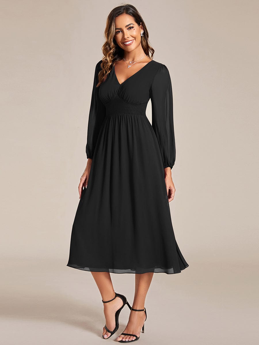 Model wearing Weitese black chiffon V-neck long sleeve midi dress.