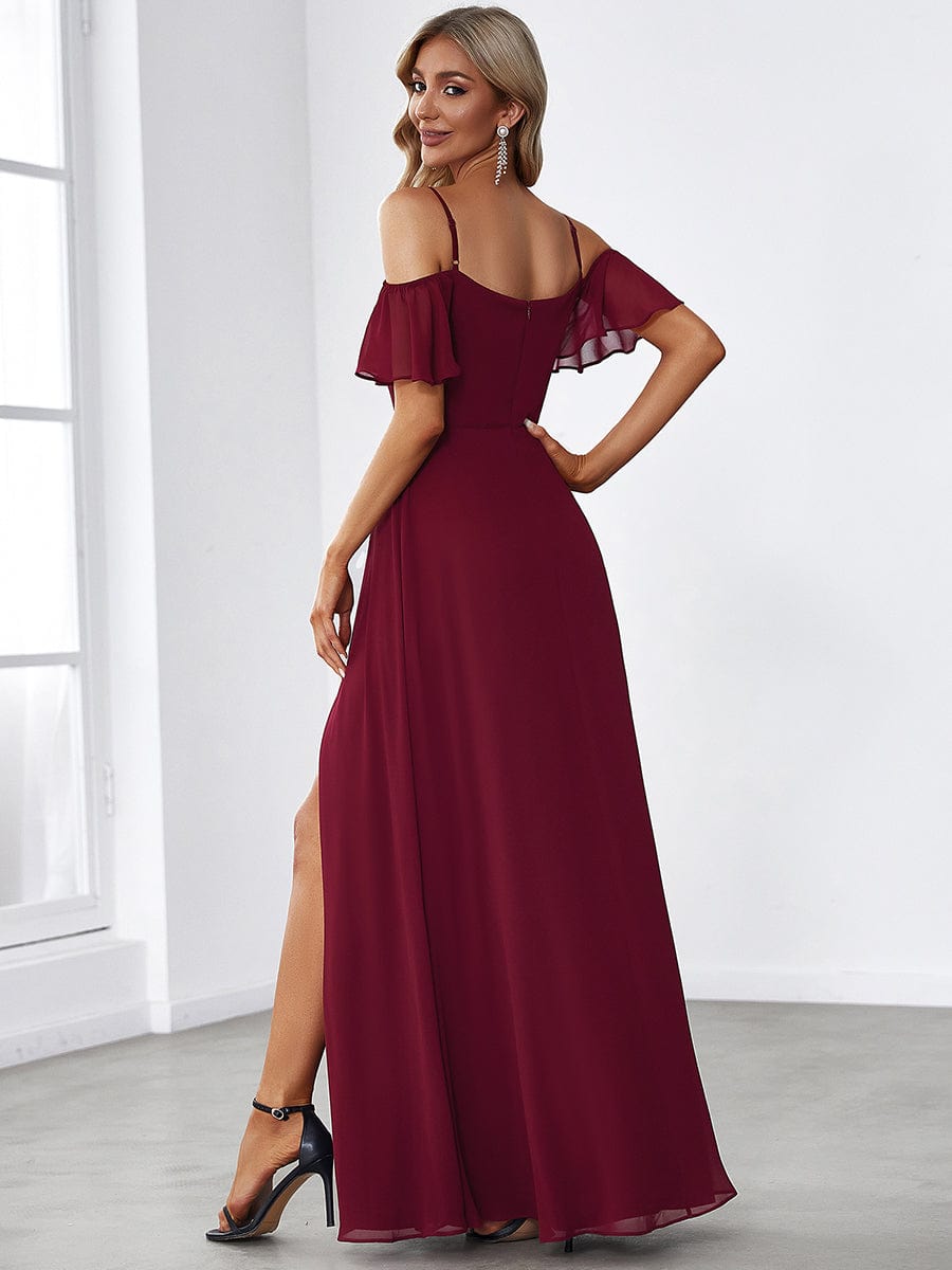 Back view of a blue cold shoulder flare sleeve dress.