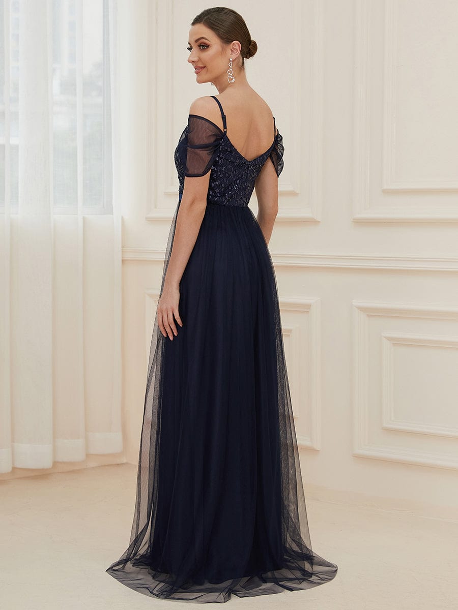 Back view of the navy blue cold shoulder sequin bodice long tulle bridesmaid dress.