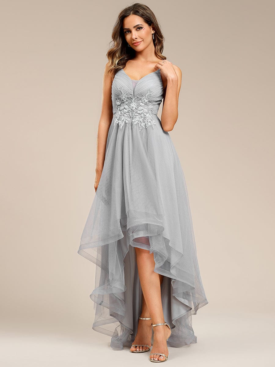 Grey floral embroidered high-low prom dress on a model.