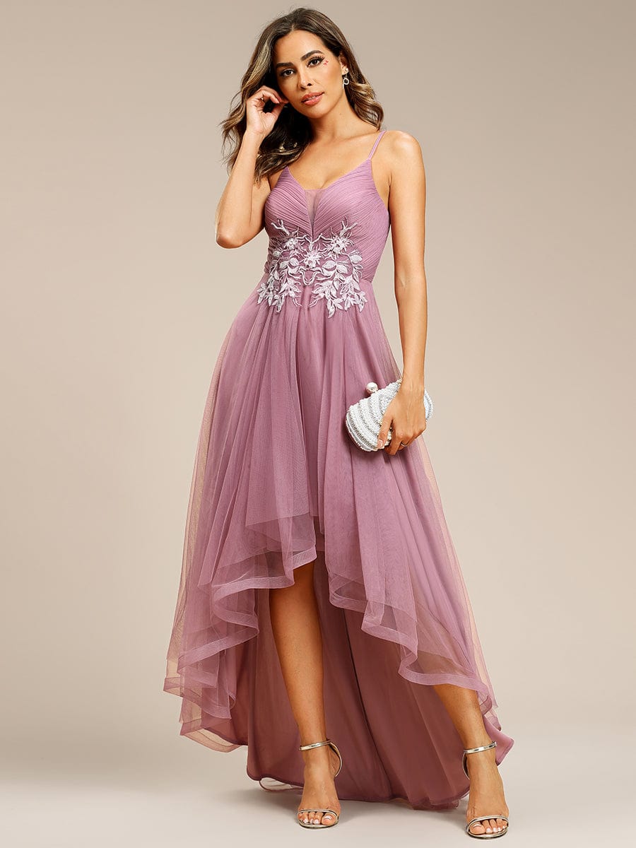 Olive green floral embroidered high-low prom dress on a model.