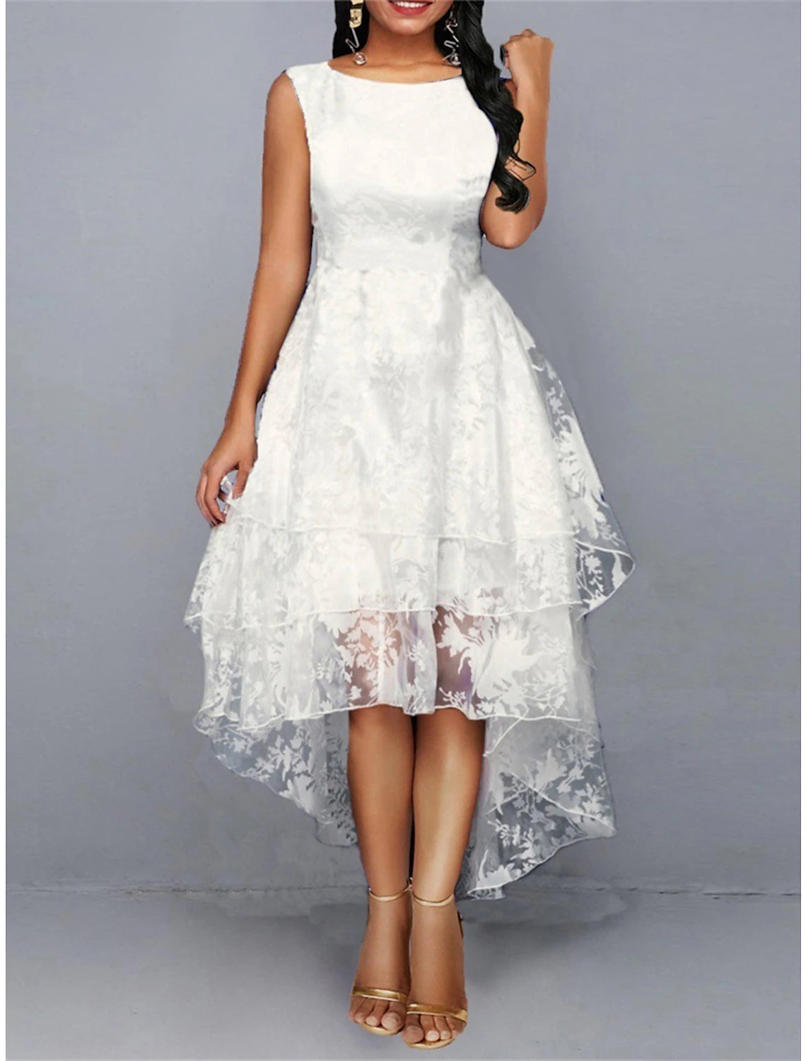 Woman wearing a white floral lace midi dress with a crew neck.