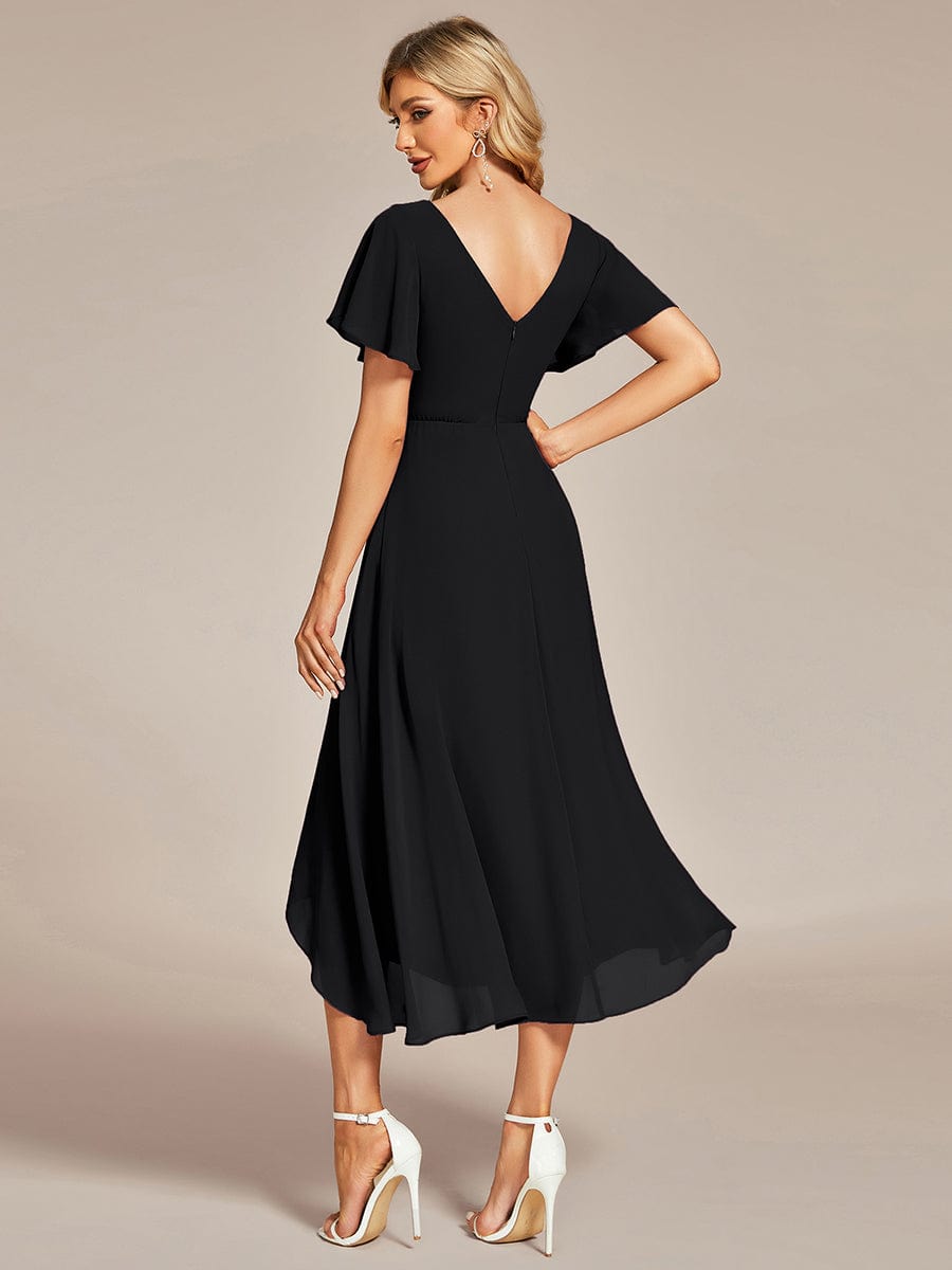 Side view of a black flowing chiffon V-neck A-line bridesmaid dress with ruffle sleeves.