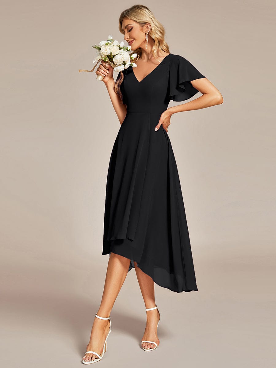 Back view of a black flowing chiffon V-neck A-line bridesmaid dress with ruffle sleeves.