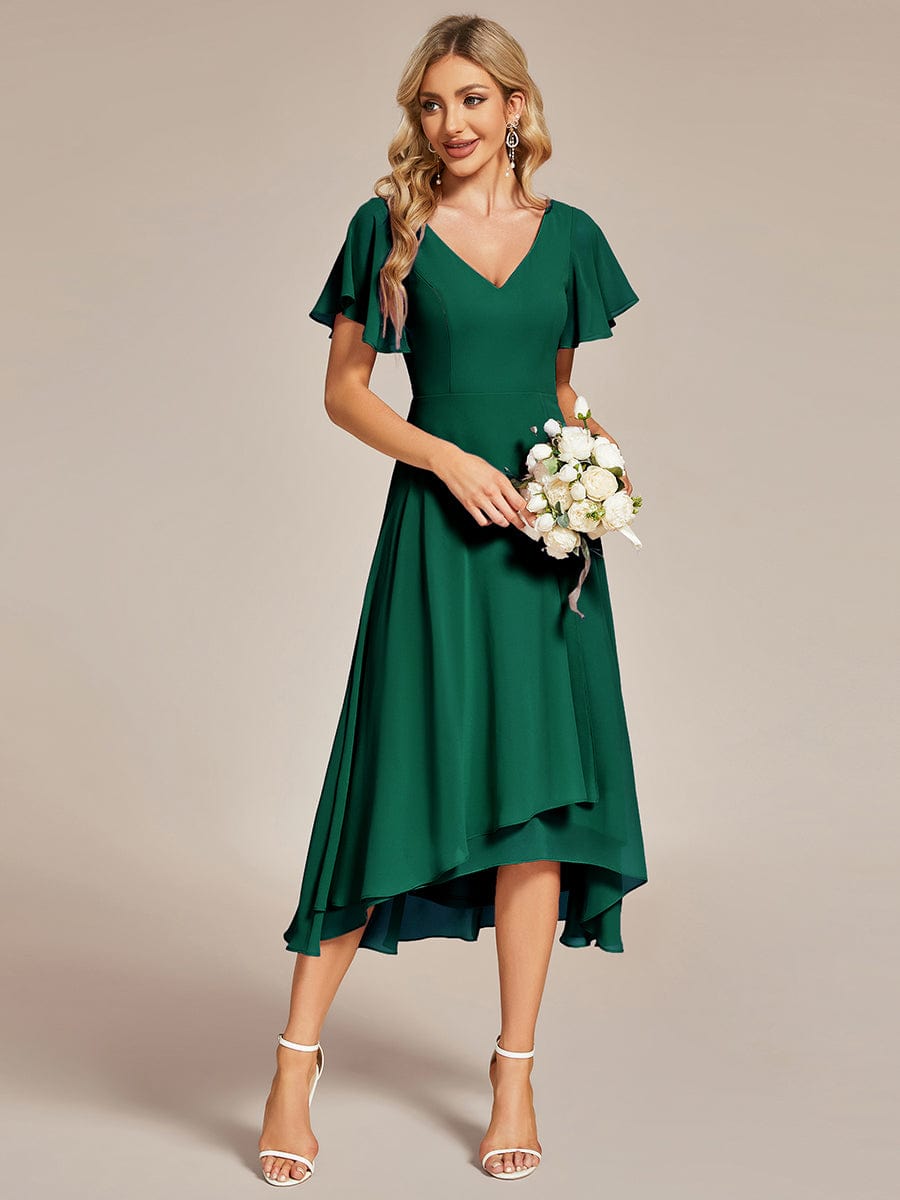 Dark green flowing chiffon V-neck A-line bridesmaid dress with ruffle sleeves.