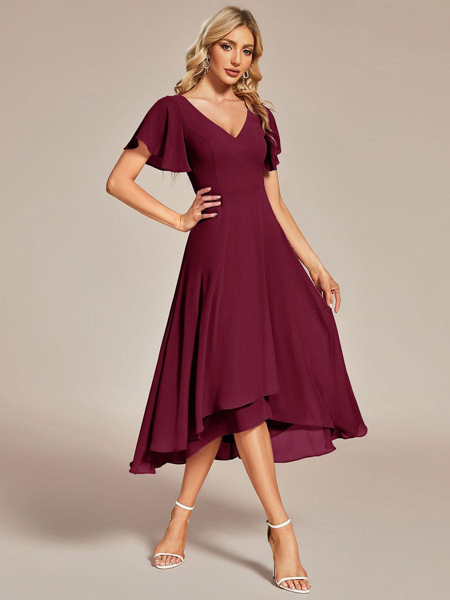 Burgundy flowing chiffon V-neck A-line bridesmaid dress with ruffle sleeves.