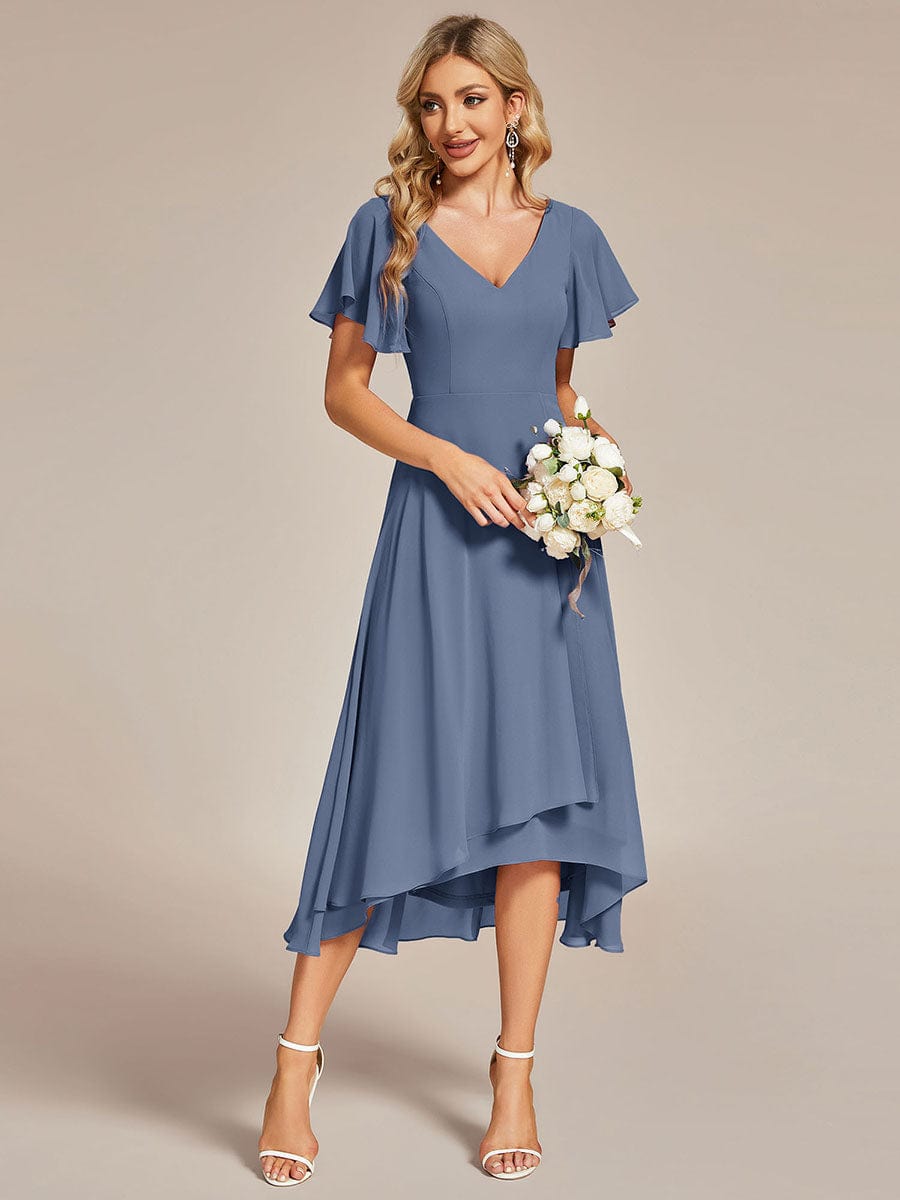 Dark navy flowing chiffon V-neck A-line bridesmaid dress with ruffle sleeves.