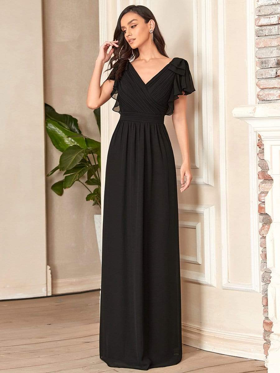Model wearing a black Weitese elegant pleated chiffon ruffle sleeve evening gown.