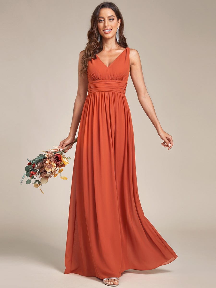 Close-up of the V-neckline and delicate chiffon fabric.