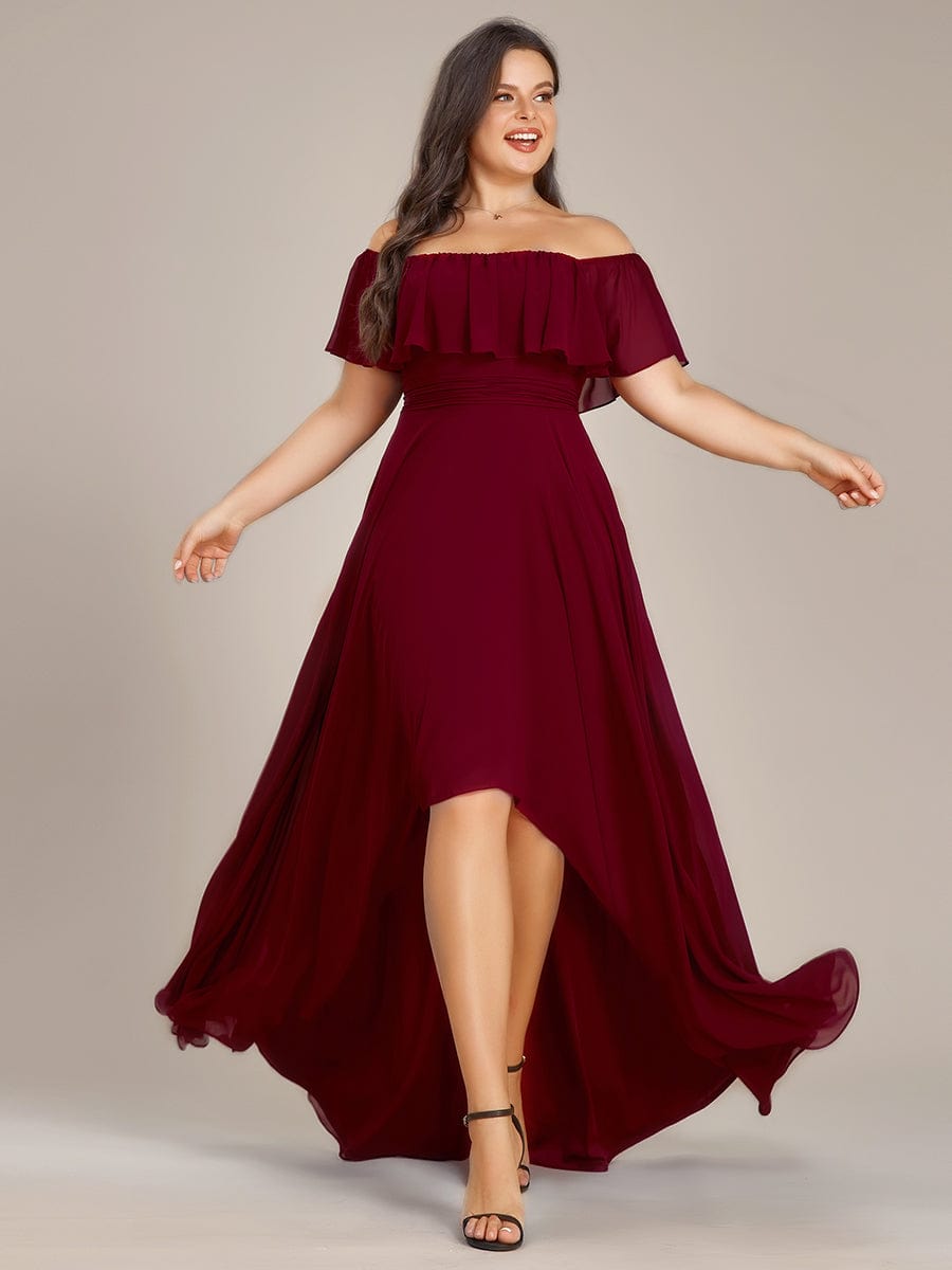 Plus size model wearing a blue off-shoulder high-low chiffon bridesmaid dress.
