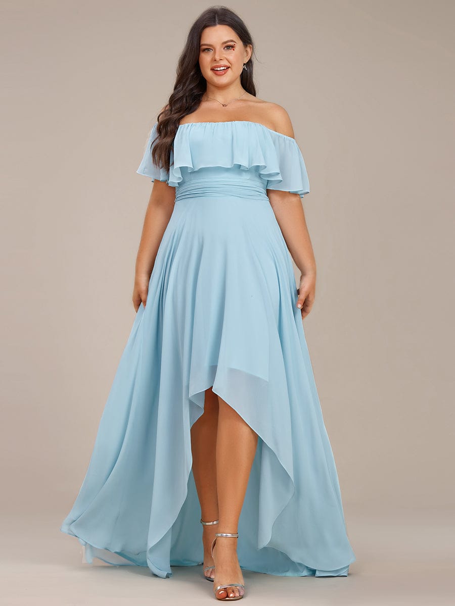 Plus size model wearing a light blue off-shoulder high-low chiffon bridesmaid dress.