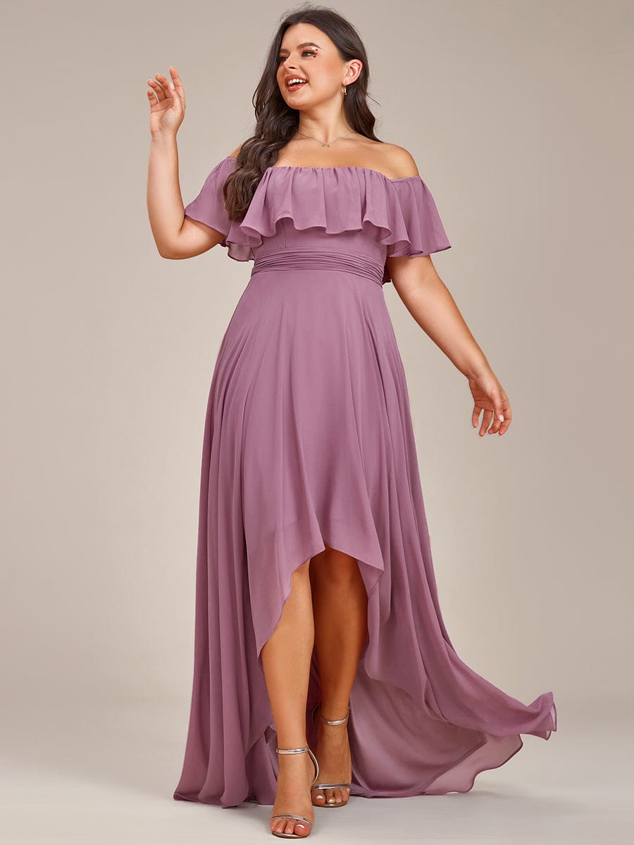 Plus size model wearing a green off-shoulder high-low chiffon bridesmaid dress.