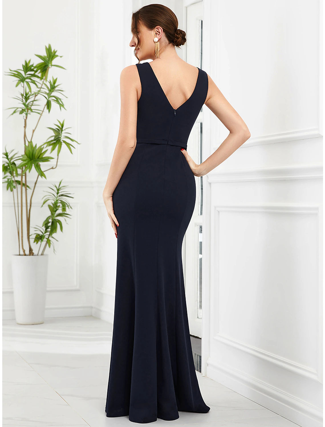 Full view of the glittering floor-length mermaid trumpet gown.