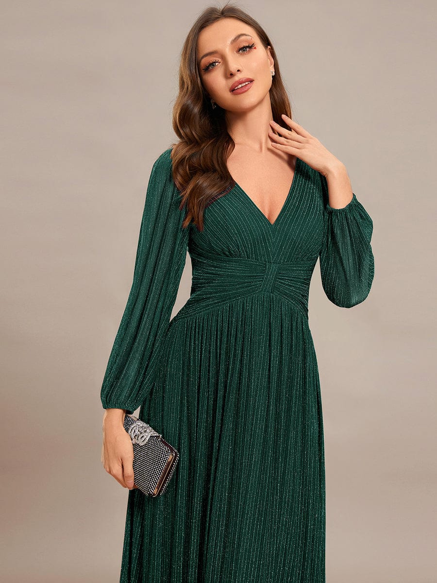 Back view of a dark green glittery A-line evening dress.