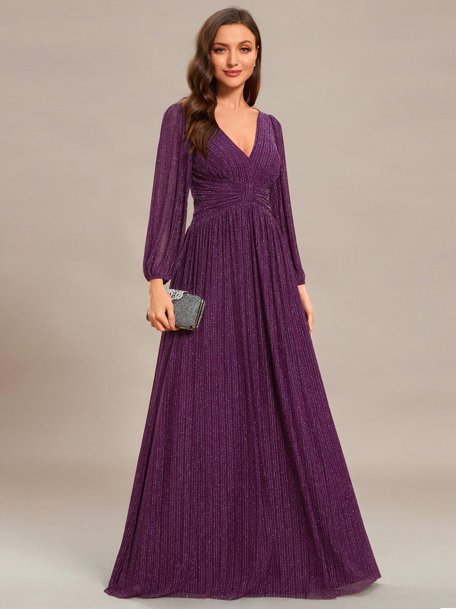 Model in a pink glittery A-line empire waist evening dress.